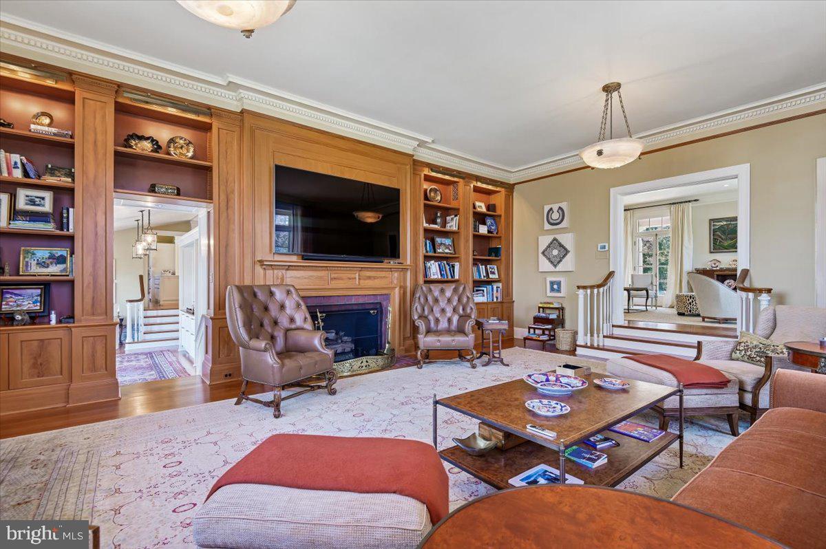 922 Rolandvue Road Baltimore, MD 21204 - Photo 16 of 89 a living room with furniture a flat screen tv and a fireplace