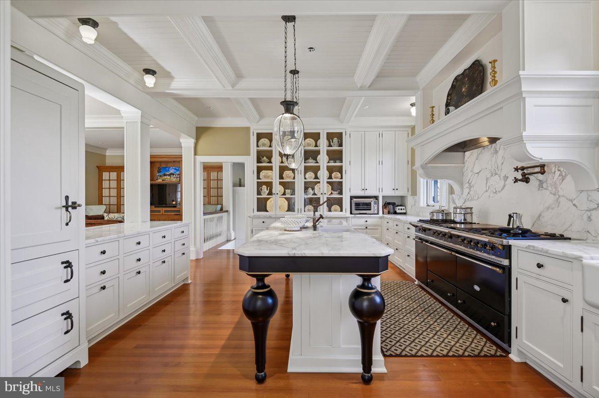 922 Rolandvue Road Baltimore, MD 21204 - Photo 17 of 89 a kitchen with stainless steel appliances kitchen island granite countertop a stove a sink and a refrigerator