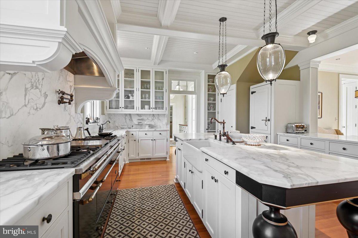 922 Rolandvue Road Baltimore, MD 21204 - Photo 20 of 89 a kitchen with stainless steel appliances granite countertop a sink a stove and a wooden floors