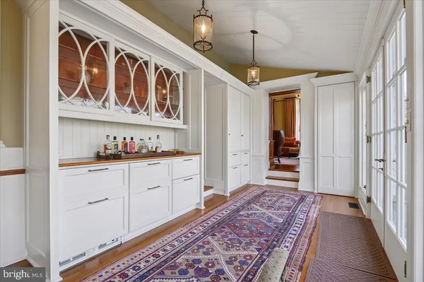 a bed room with a bed and a chair