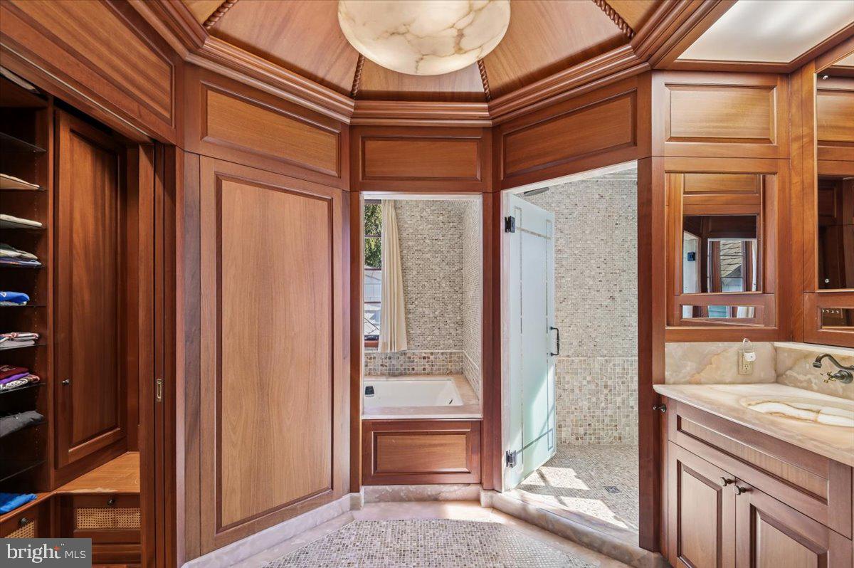 922 Rolandvue Road Baltimore, MD 21204 - Photo 40 of 89 a bathroom with a tub and a shower