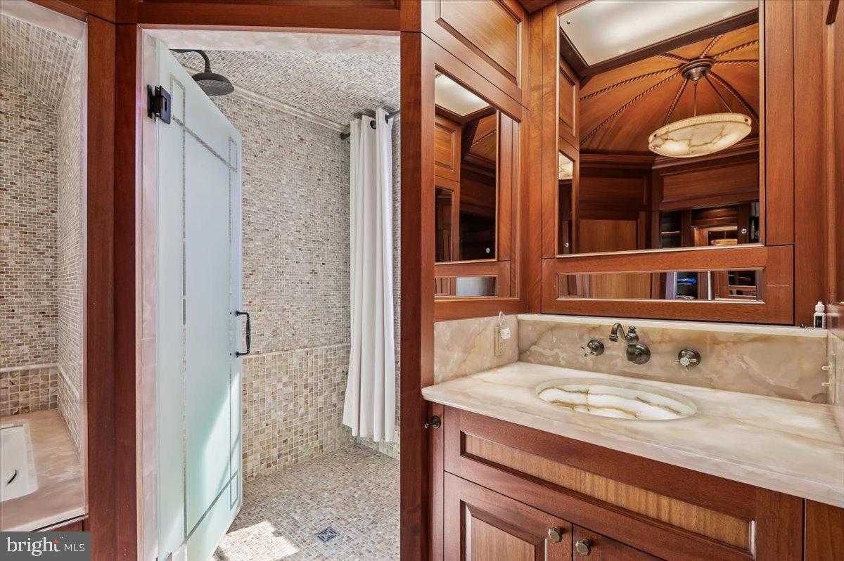 922 Rolandvue Road Baltimore, MD 21204 - Photo 41 of 89 a bathroom with a sink and a mirror