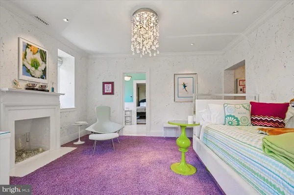 a front view of a house with swimming pool and garden