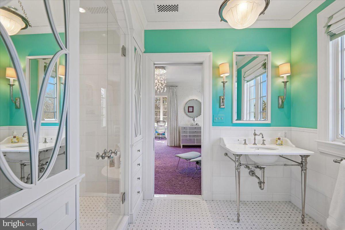 922 Rolandvue Road Baltimore, MD 21204 - Photo 52 of 89 a en suite bathroom with a sink a mirror and a shower