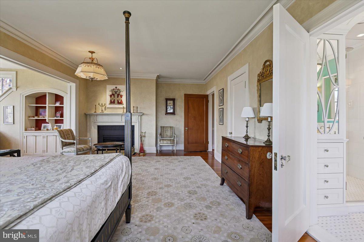 922 Rolandvue Road Baltimore, MD 21204 - Photo 55 of 89 a living room with furniture a fireplace and a chandelier