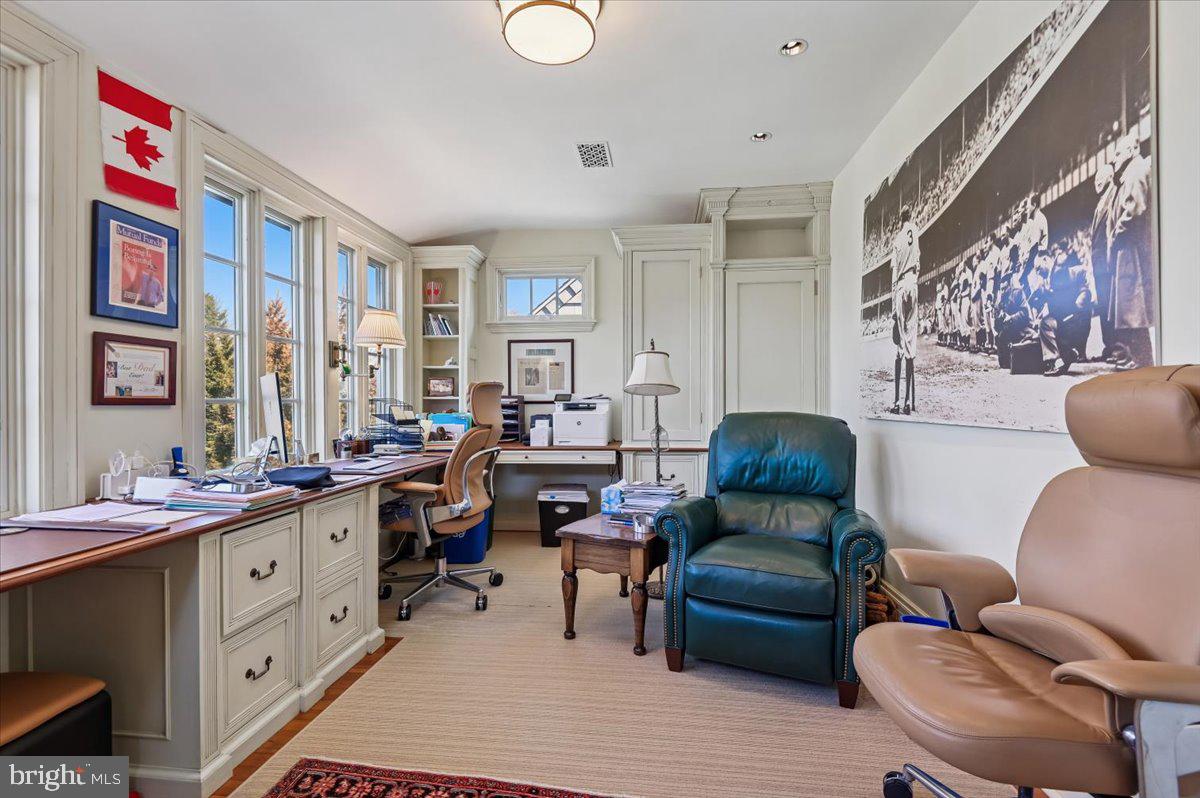 922 Rolandvue Road Baltimore, MD 21204 - Photo 59 of 89 a living room with furniture a couch and paintings on the wall