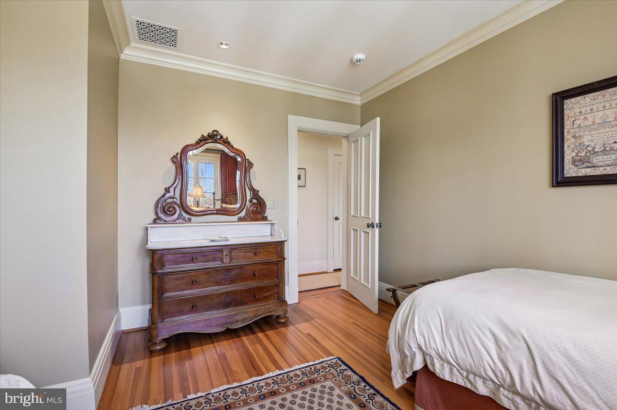 922 Rolandvue Road Baltimore, MD 21204 - Photo 65 of 89 a bedroom with a bed and cabinet