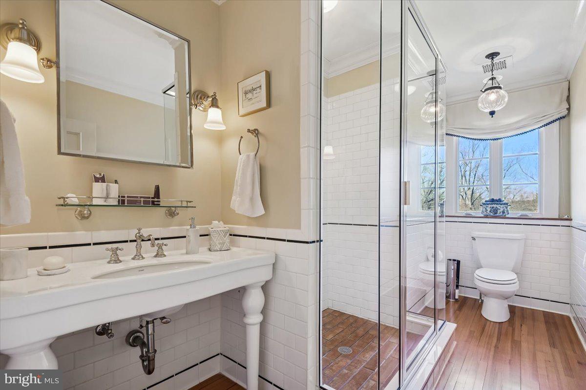 922 Rolandvue Road Baltimore, MD 21204 - Photo 67 of 89 a bathroom with a sink a toilet and a mirror