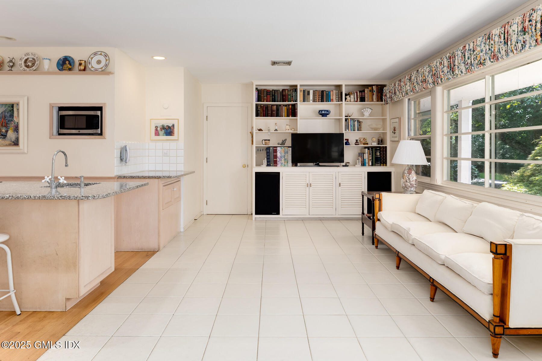 267 Riversville Road Greenwich, CT 06831 - Photo 15 of 23 a living room with stainless steel appliances furniture and a flat screen tv