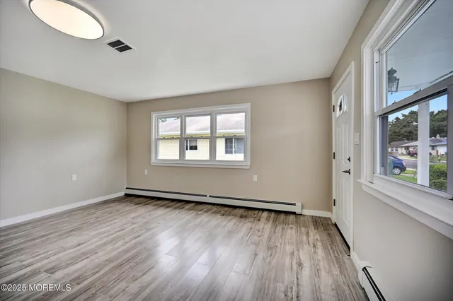 a kitchen with a refrigerator and a stove top oven