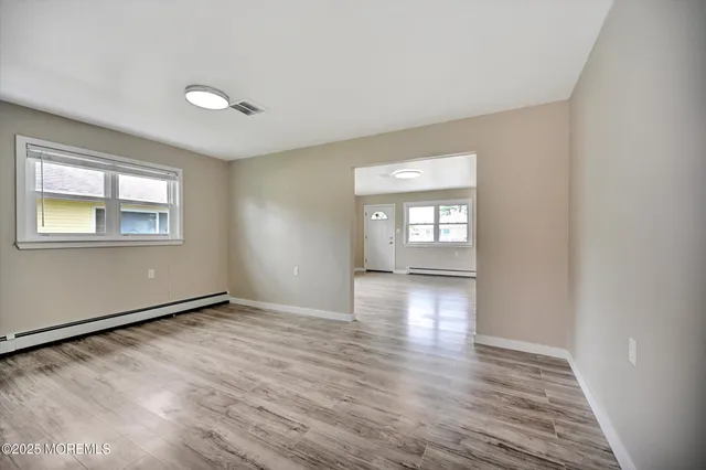 a view of an empty room with a large window