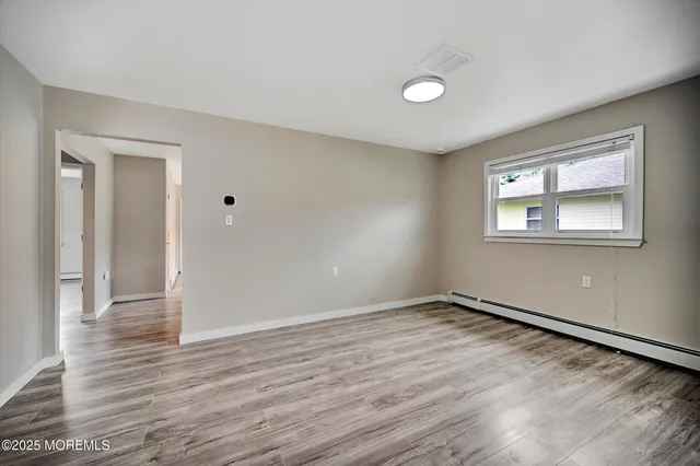 a view of room with window and floor to ceiling window