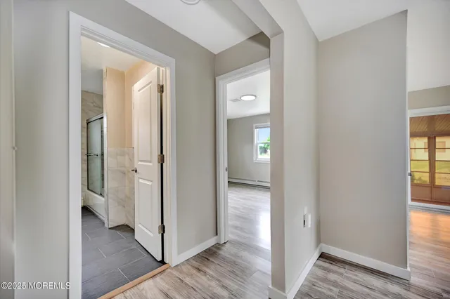 a view of a bathroom from a hallway