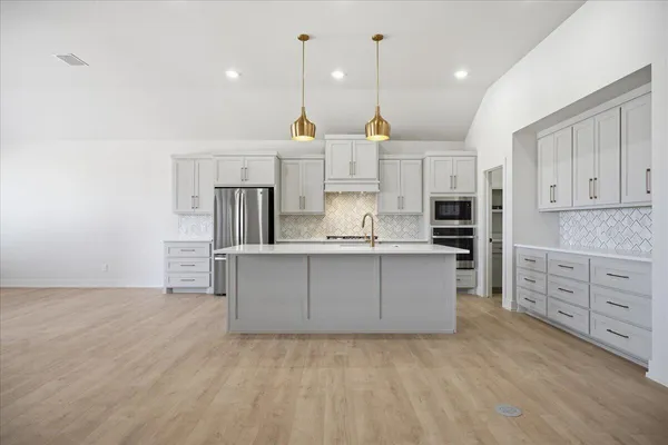 a large kitchen with cabinets
