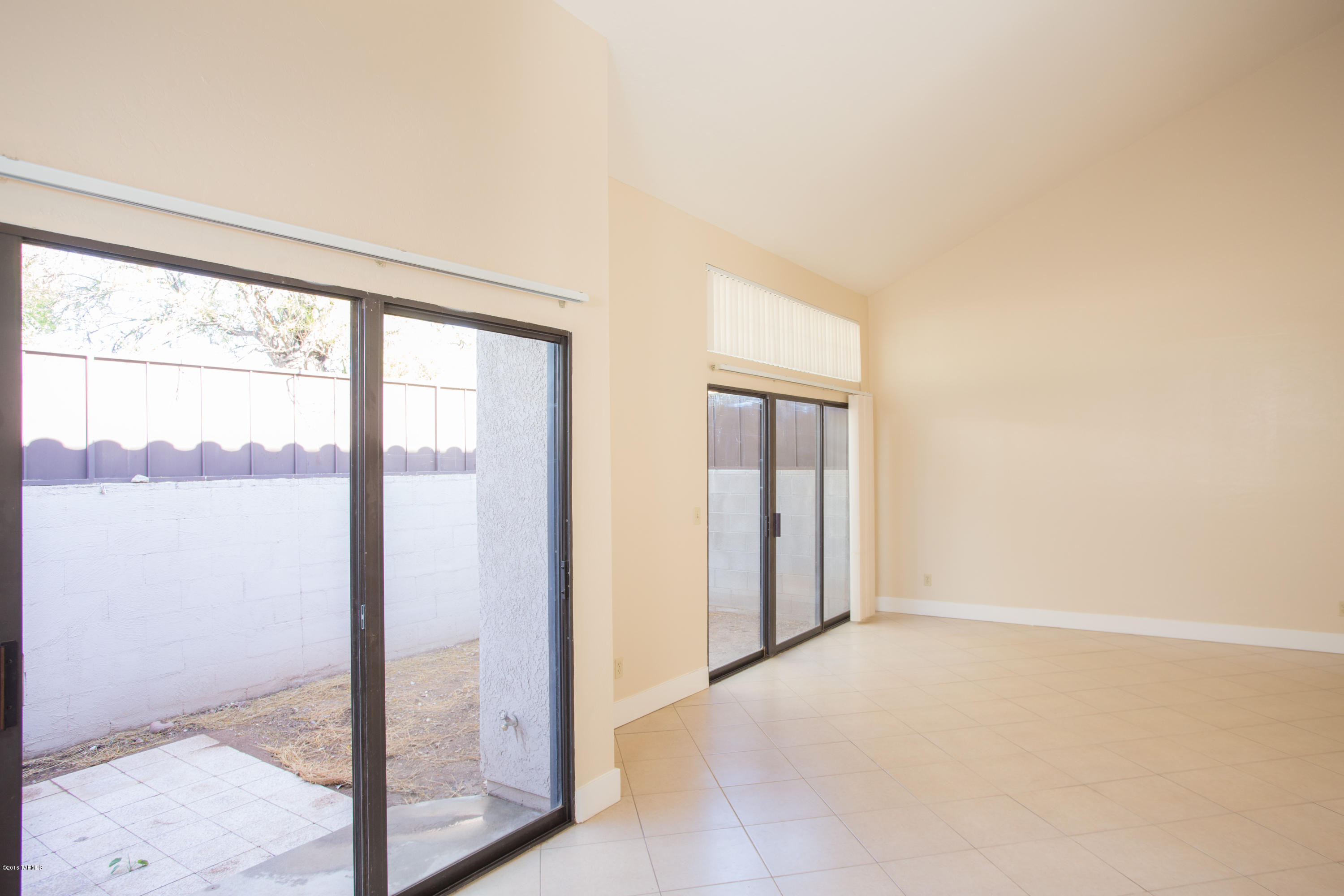 242 East Pastime Road Tucson, AZ 85705 - Photo 5 of 20 a view of an empty room and window