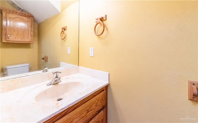 a room with wooden floor fan and windows