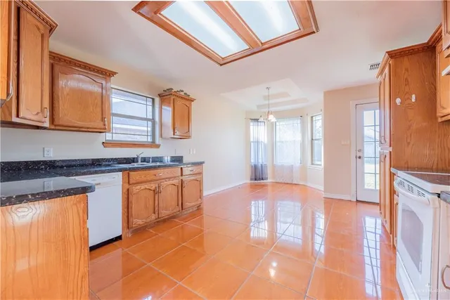 a view of a bedroom with window and ceiling fan