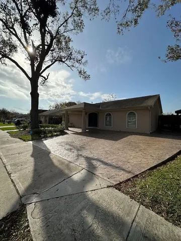 a front view of a house with trees