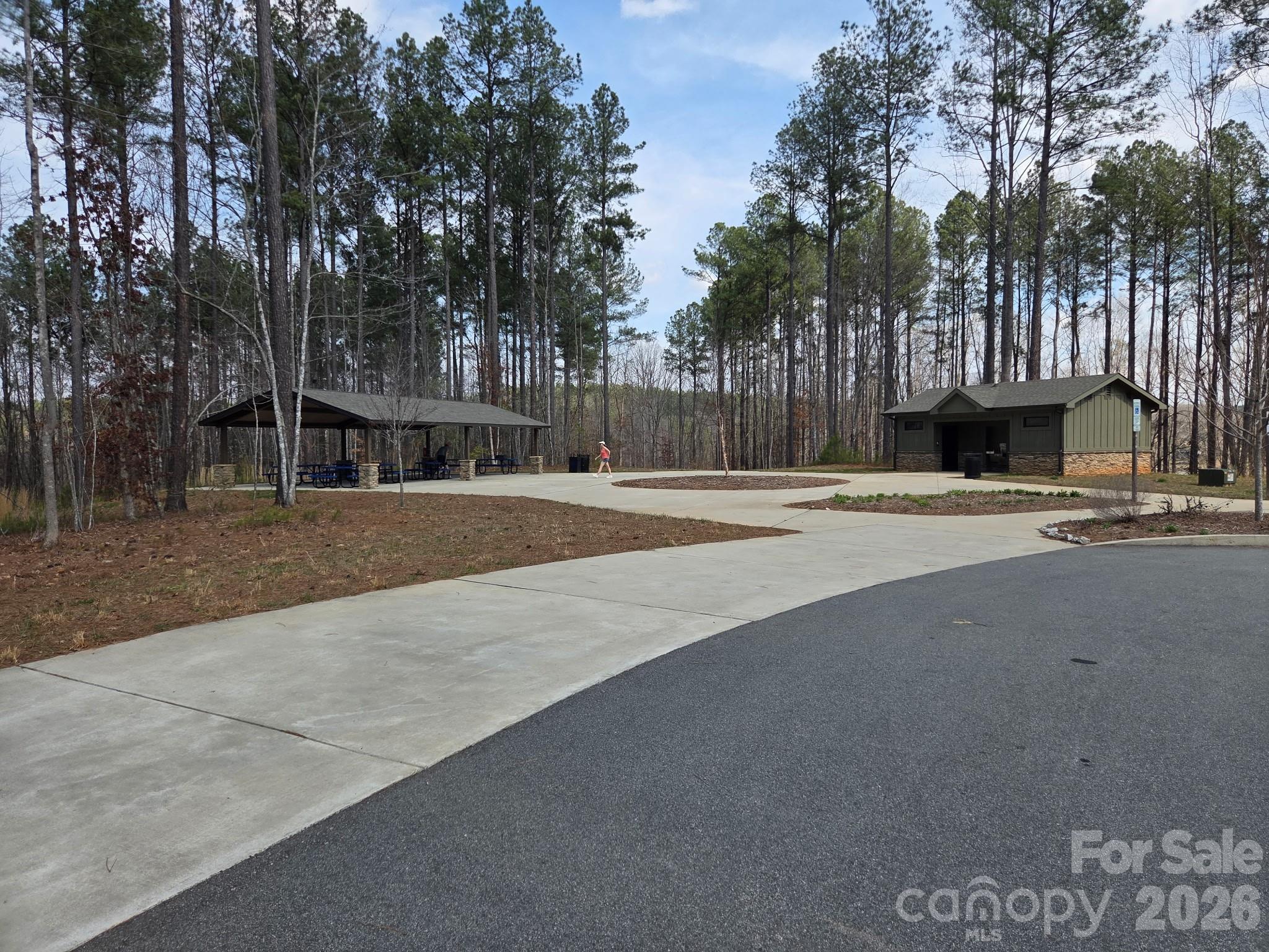7220 Little Mountain Road Sherrills Ford, NC 28673 - Photo 13 of 18 a white house with a trees in the background