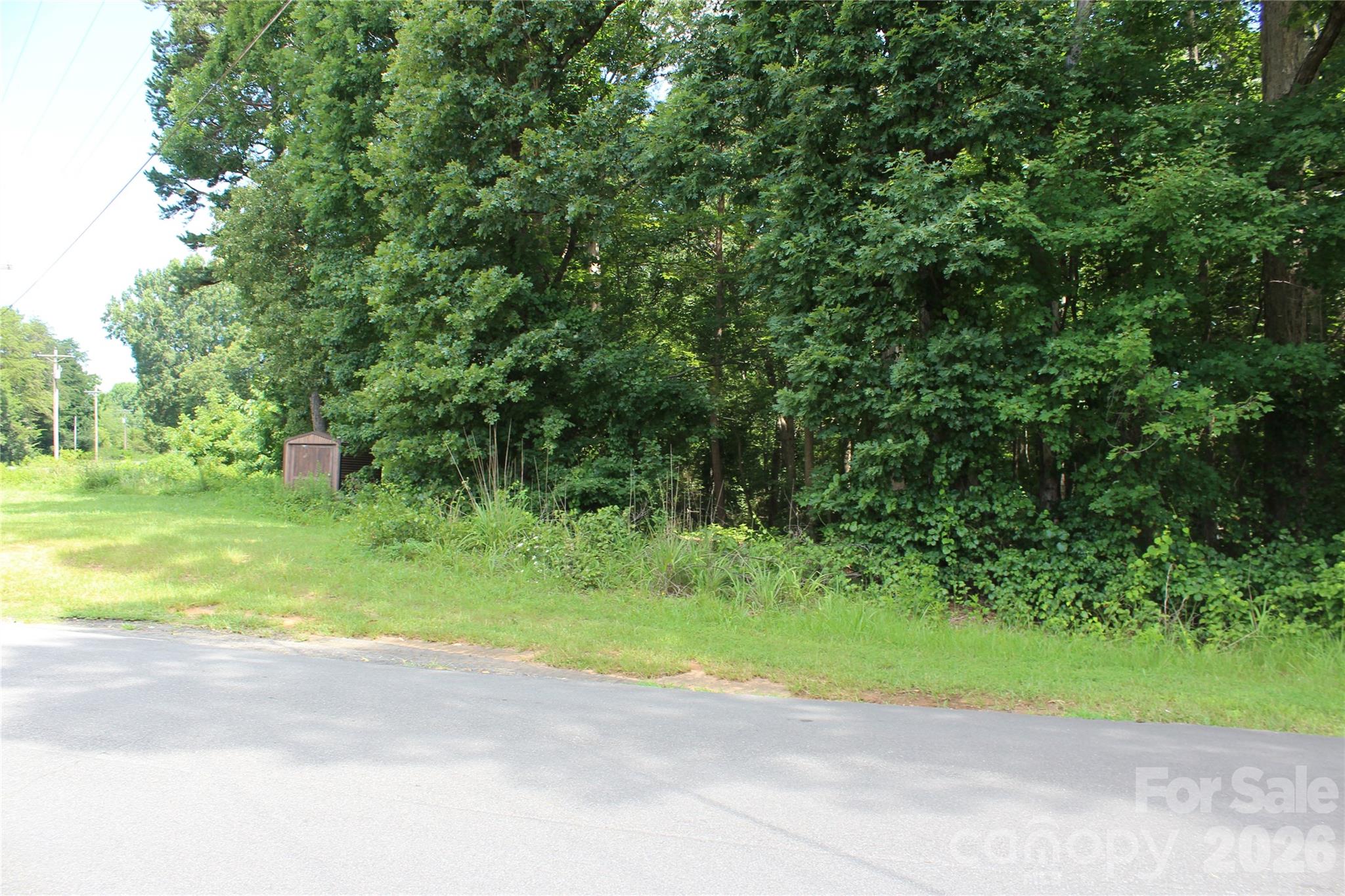 7220 Little Mountain Road Sherrills Ford, NC 28673 - Photo 7 of 18 a view of a road with a yard