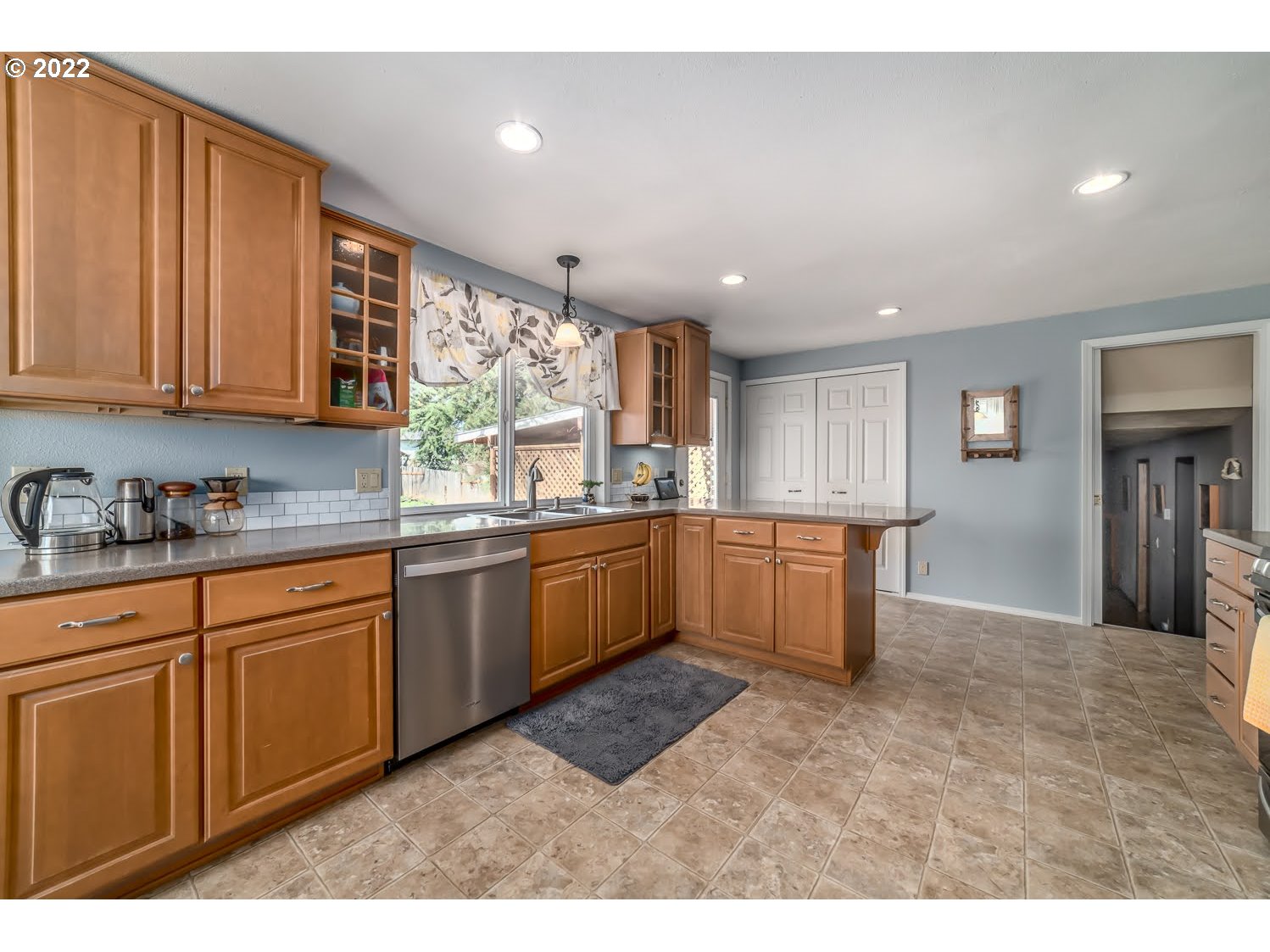 6520 E Street Springfield, OR 97478 - Photo 11 of 32 a kitchen with a sink cabinets and window