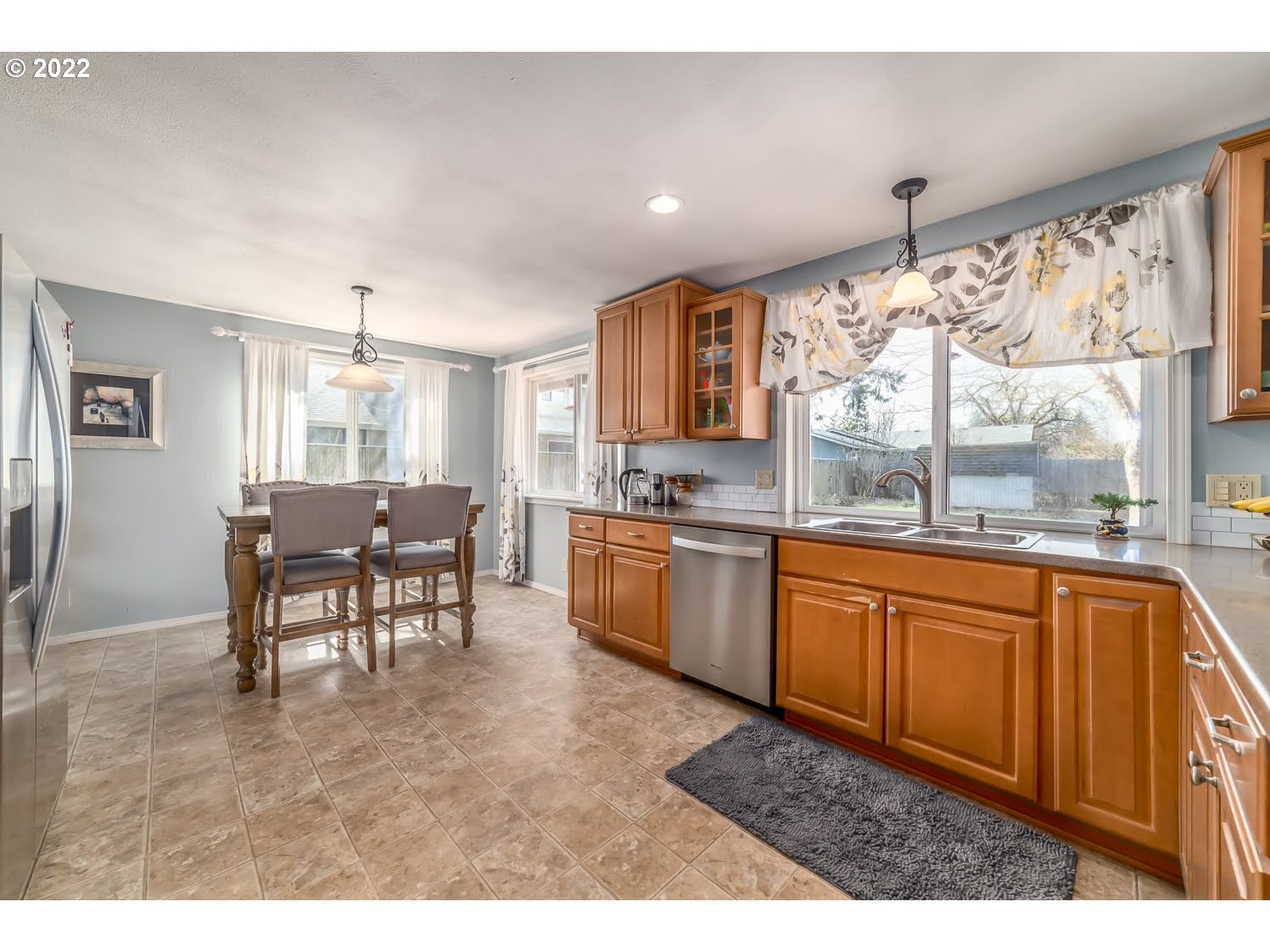 6520 E Street Springfield, OR 97478 - Photo 12 of 32 a open kitchen with granite countertop a stove sink and cabinets