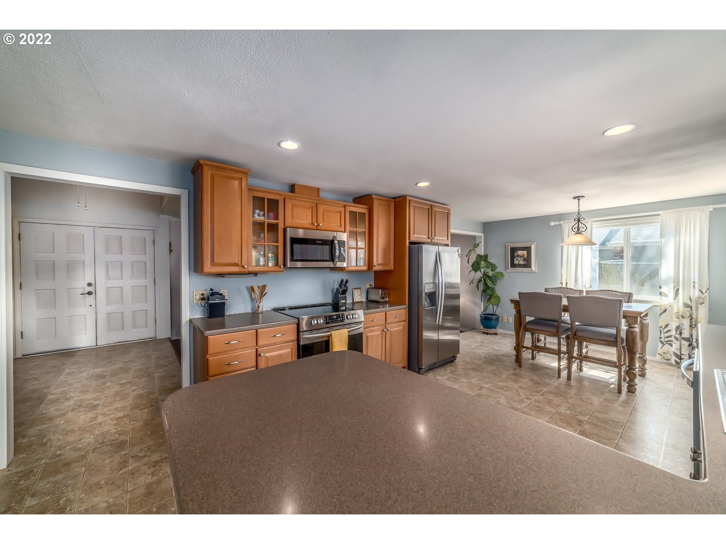 6520 E Street Springfield, OR 97478 - Photo 14 of 32 a living room with stainless steel appliances furniture cabinets and a counter top space