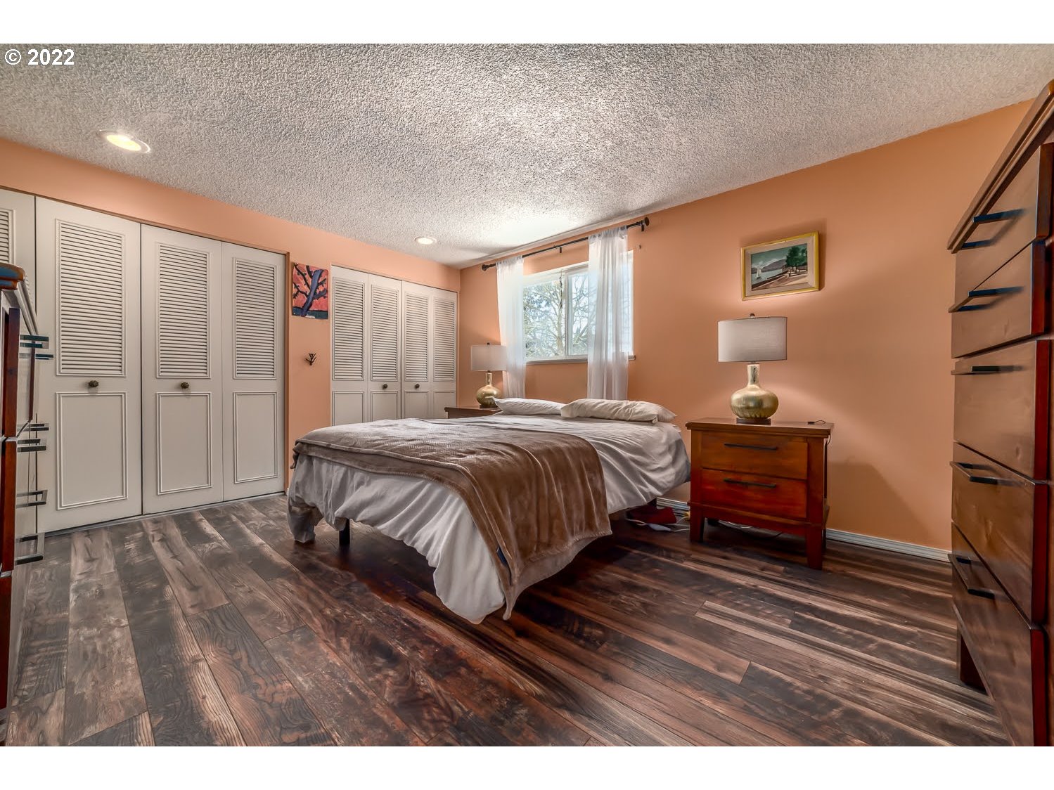 6520 E Street Springfield, OR 97478 - Photo 18 of 32 a bedroom with a bed and a dresser