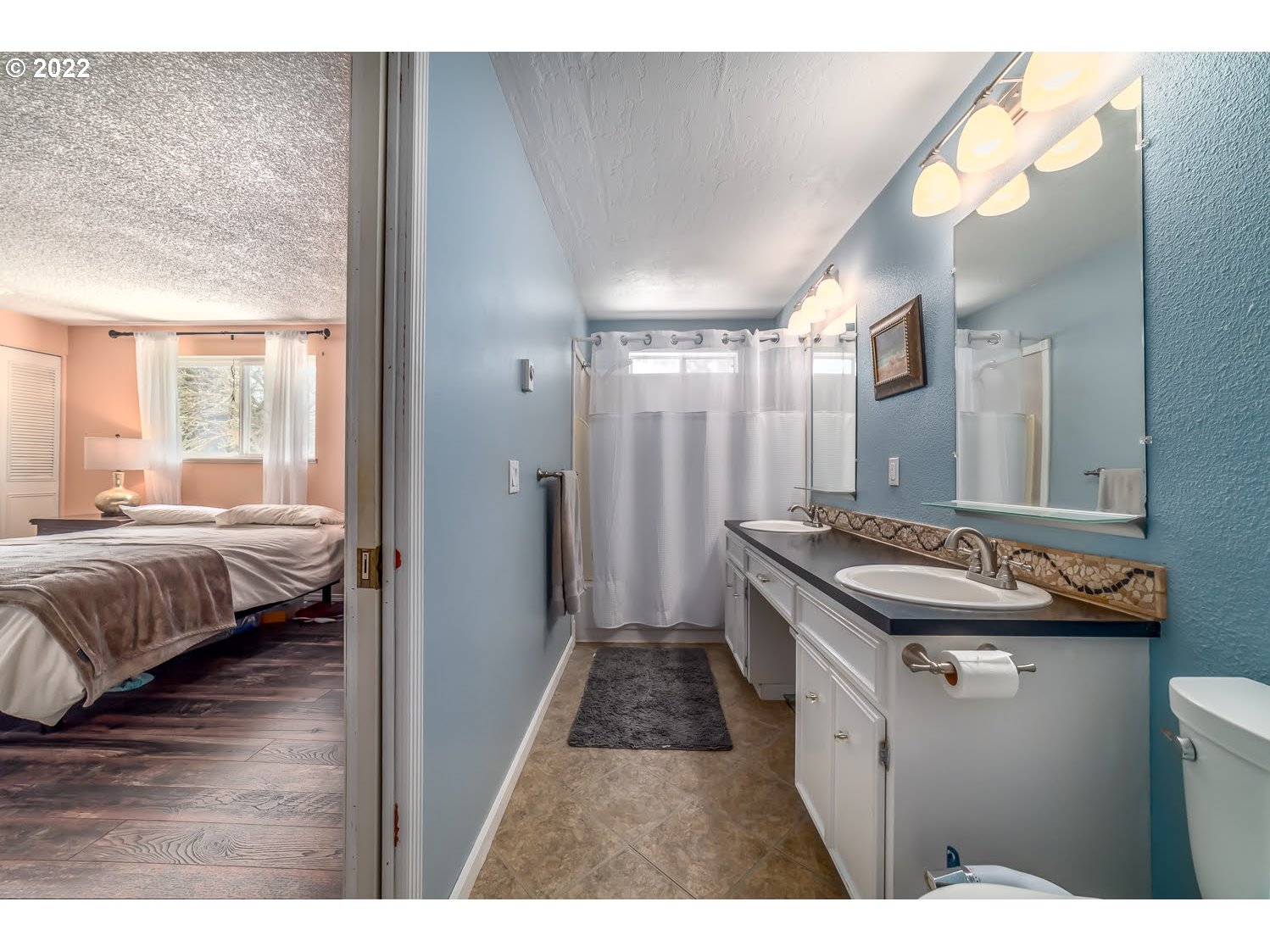 6520 E Street Springfield, OR 97478 - Photo 20 of 32 a bathroom with a sink and a mirror