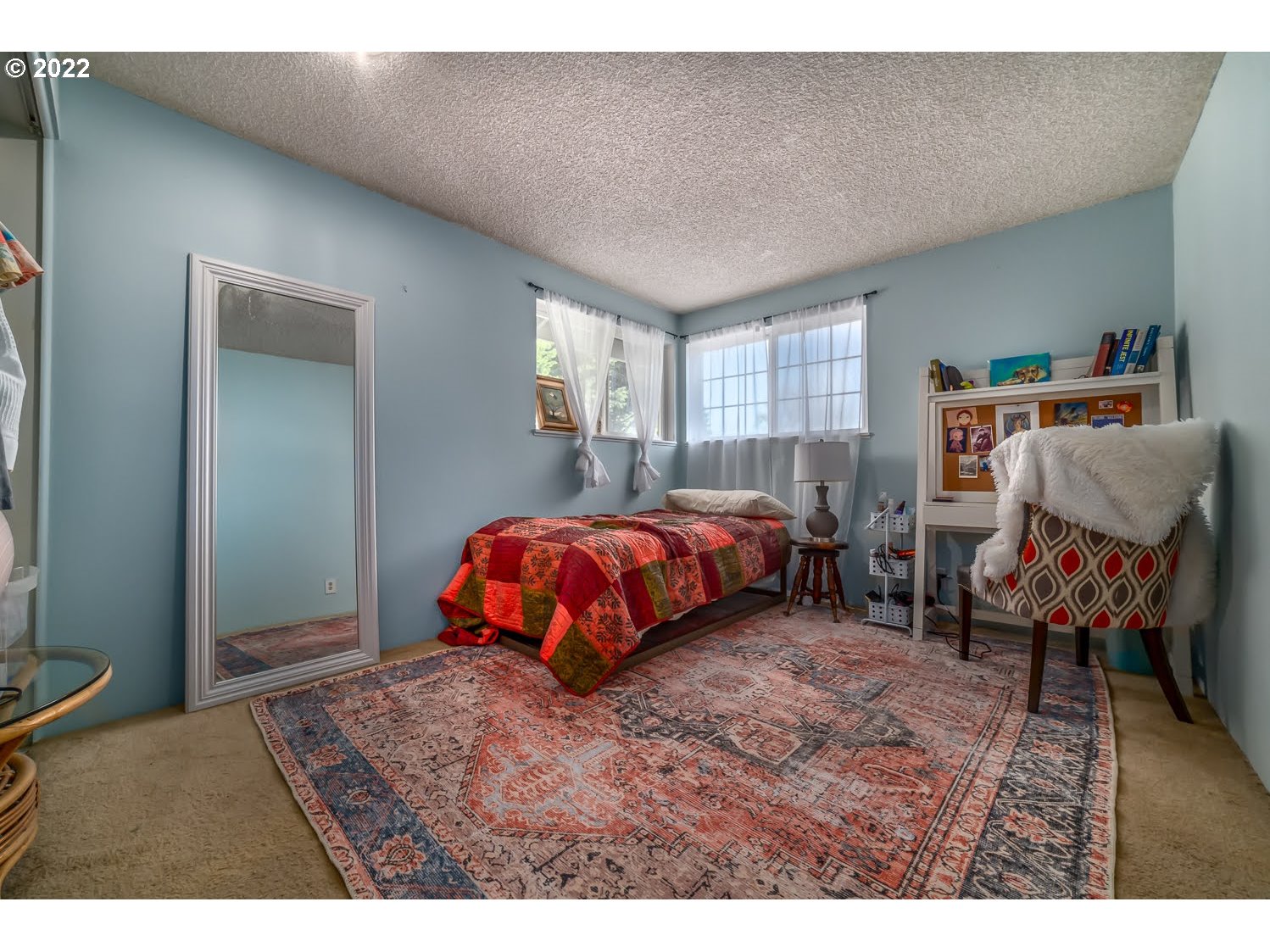 6520 E Street Springfield, OR 97478 - Photo 22 of 32 a bedroom with a bed and a window