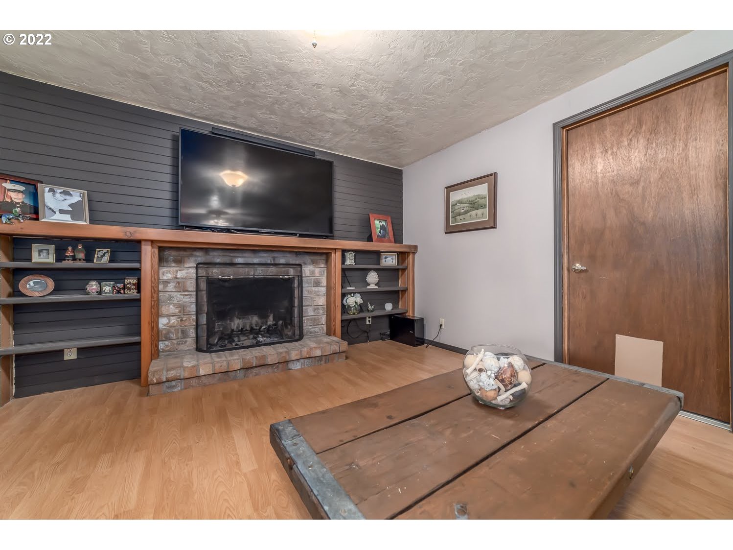 6520 E Street Springfield, OR 97478 - Photo 25 of 32 a living room with furniture and a fireplace