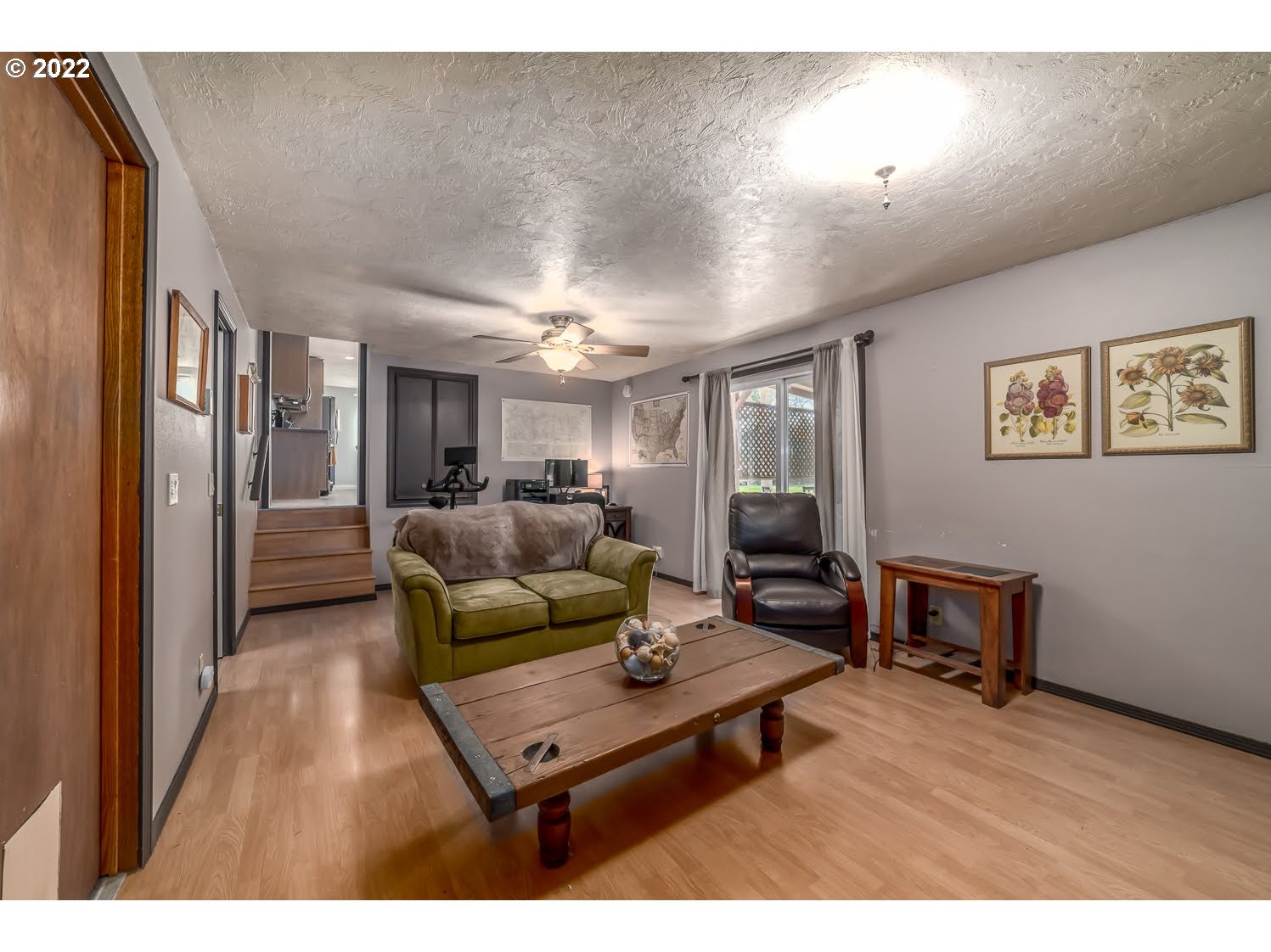 6520 E Street Springfield, OR 97478 - Photo 26 of 32 a living room with furniture and a wooden floor