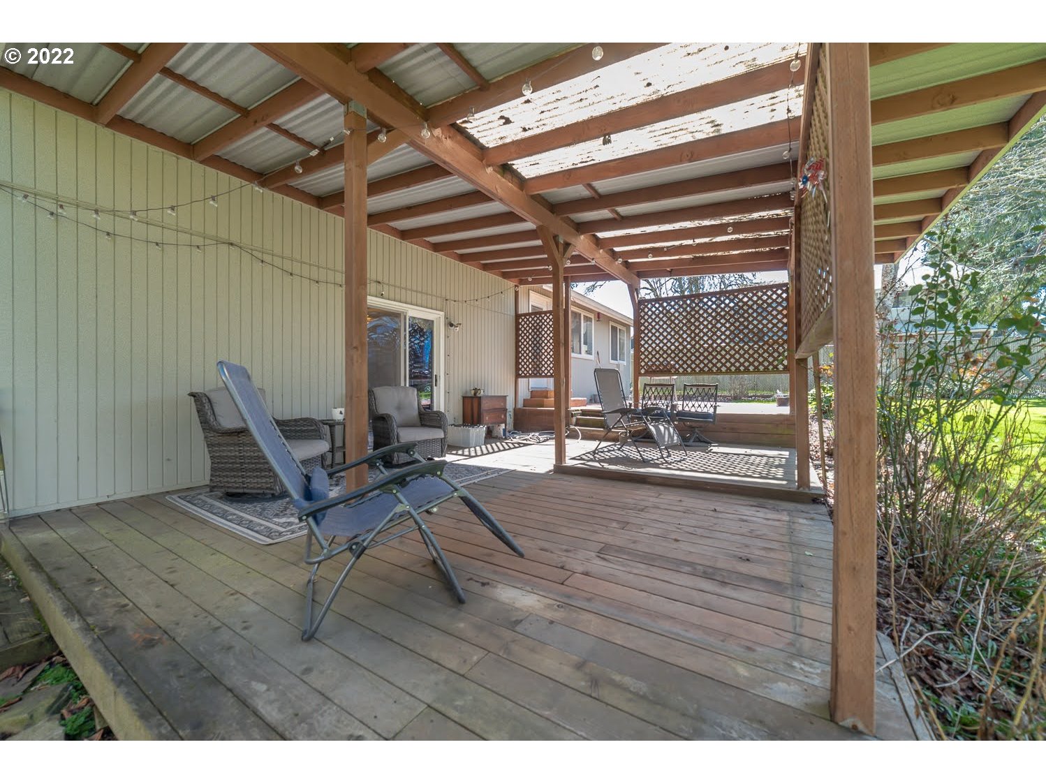 6520 E Street Springfield, OR 97478 - Photo 27 of 32 a view of a patio with table and chairs and potted plants
