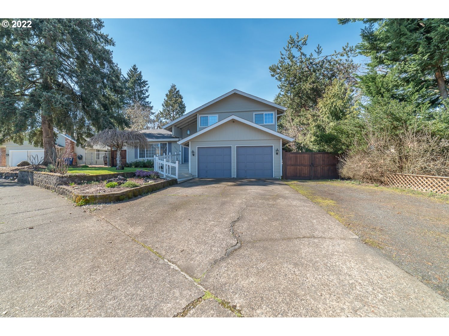 6520 E Street Springfield, OR 97478 - Photo 3 of 32 a front view of a house with a yard and trees