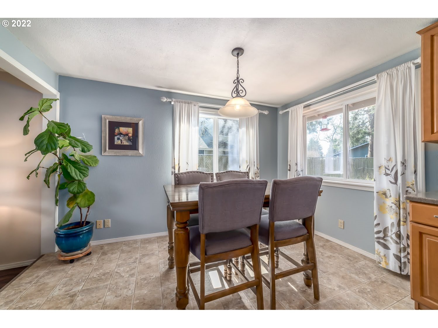 6520 E Street Springfield, OR 97478 - Photo 9 of 32 a view of a dining room with furniture window and wooden floor