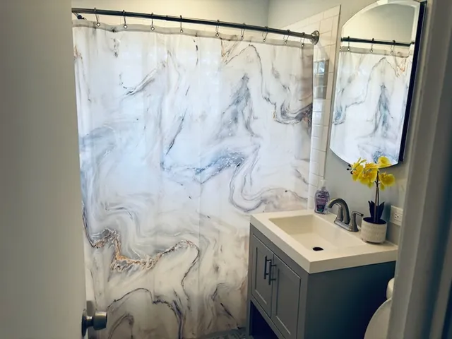 a bathroom with a sink and mirror