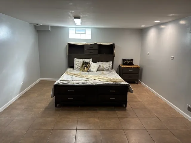 a bed room with a bed and a night stand