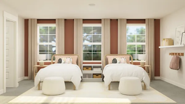 a bedroom with two beds and large window