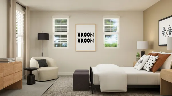 a bedroom with a couch and a window