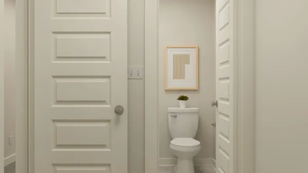 a bathroom with a toilet and a sink