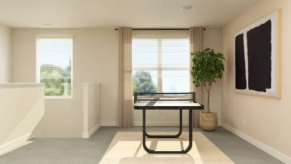 a view of a room with a window and wooden floor