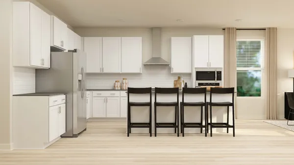 a kitchen with stainless steel appliances granite countertop a stove top oven a sink and cabinets