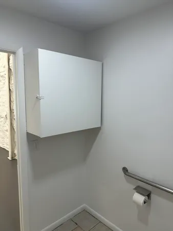 a view of a room with racks on the wall