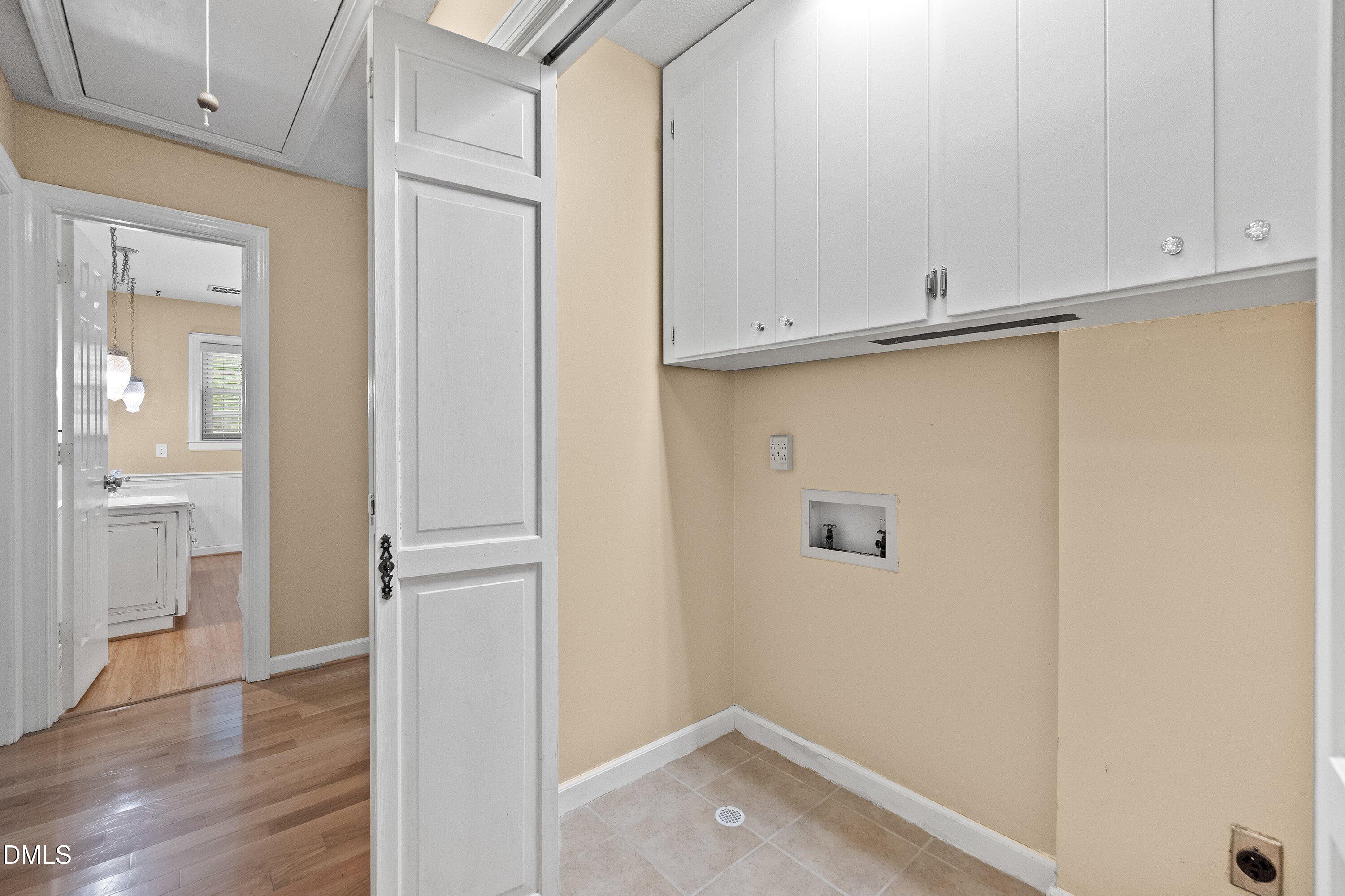 8133 Holly Forest Road Wake Forest, NC 27587 - Photo 40 of 50 a view of storage and utility room with wooden floor