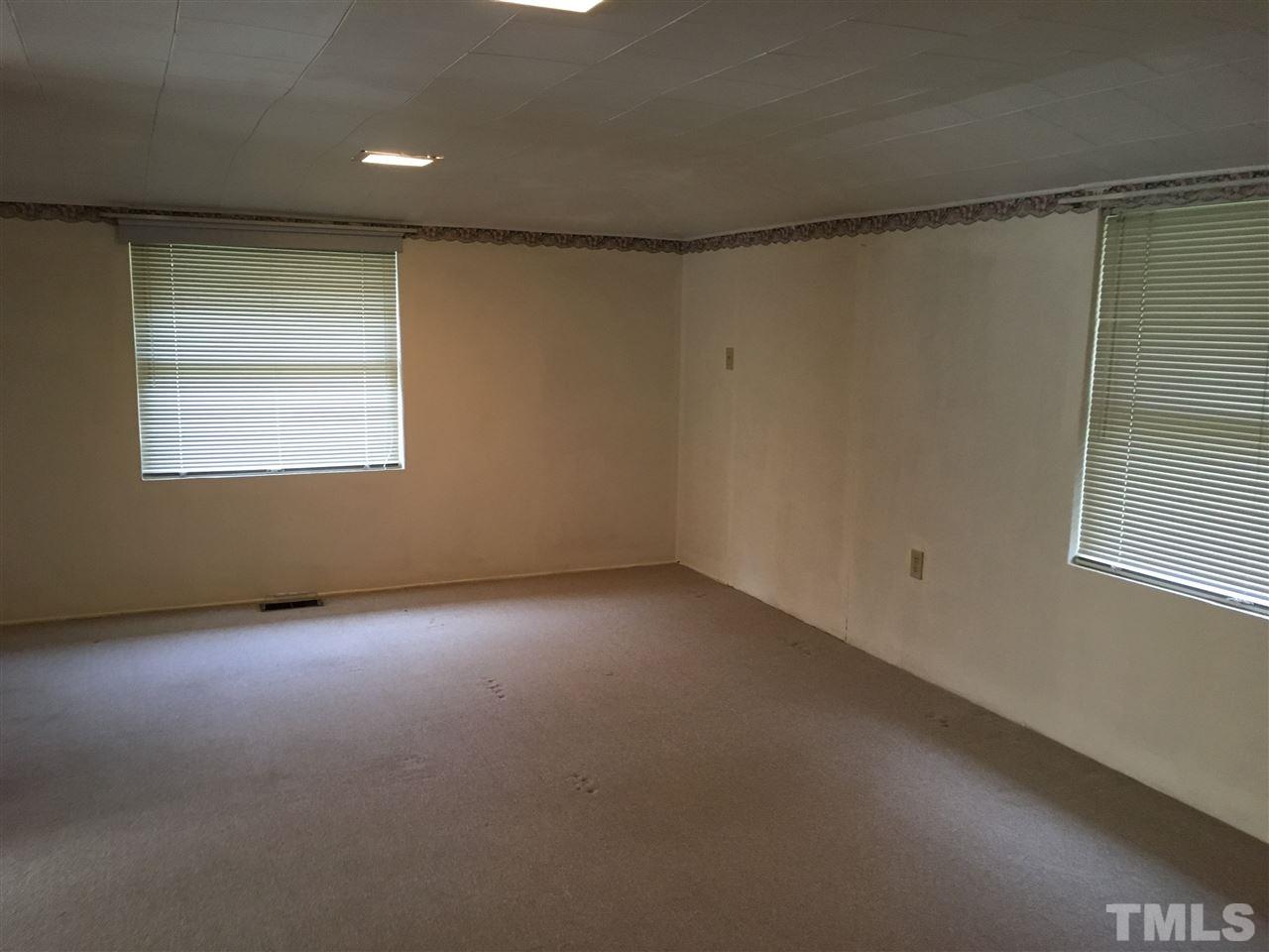 31 Service Road Roxboro, NC 27574 - Photo 11 of 18 an empty room with a window