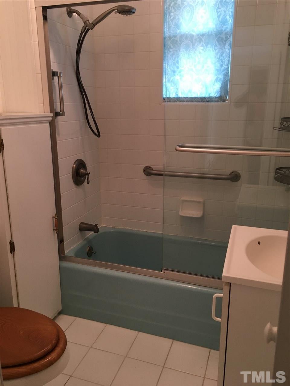 31 Service Road Roxboro, NC 27574 - Photo 14 of 18 a bathroom with a bath tub and a shower