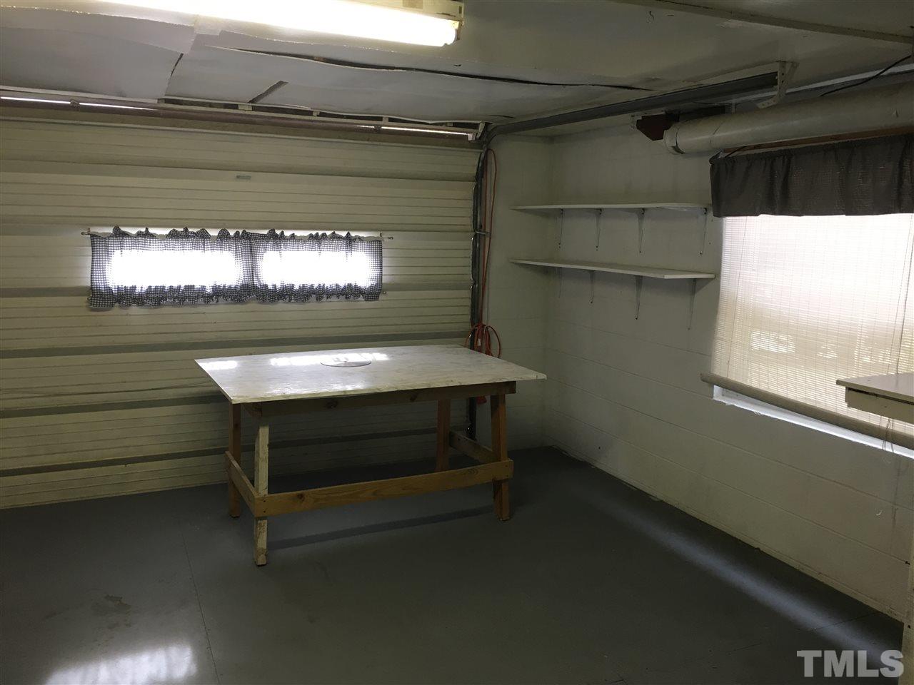 31 Service Road Roxboro, NC 27574 - Photo 16 of 18 a room with furniture and a window