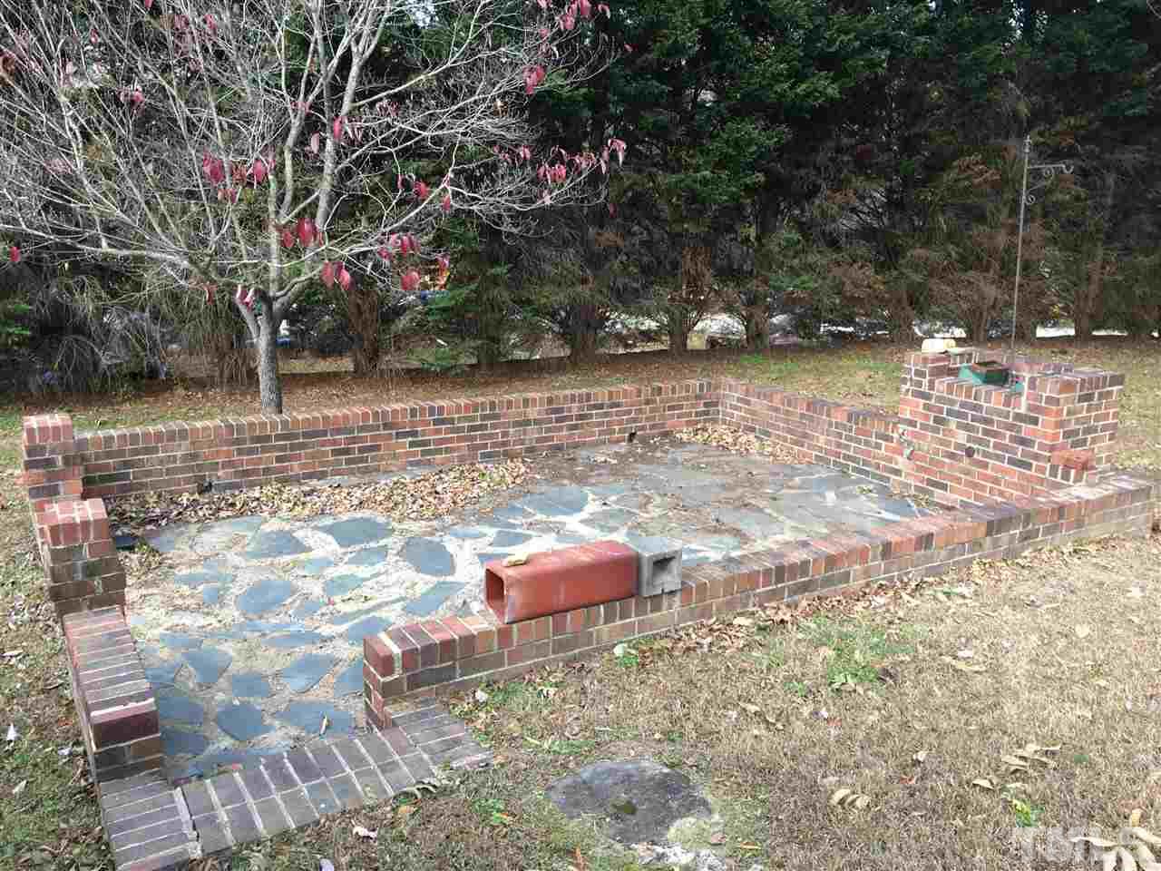 31 Service Road Roxboro, NC 27574 - Photo 4 of 18 a backyard of a house with lots of green space