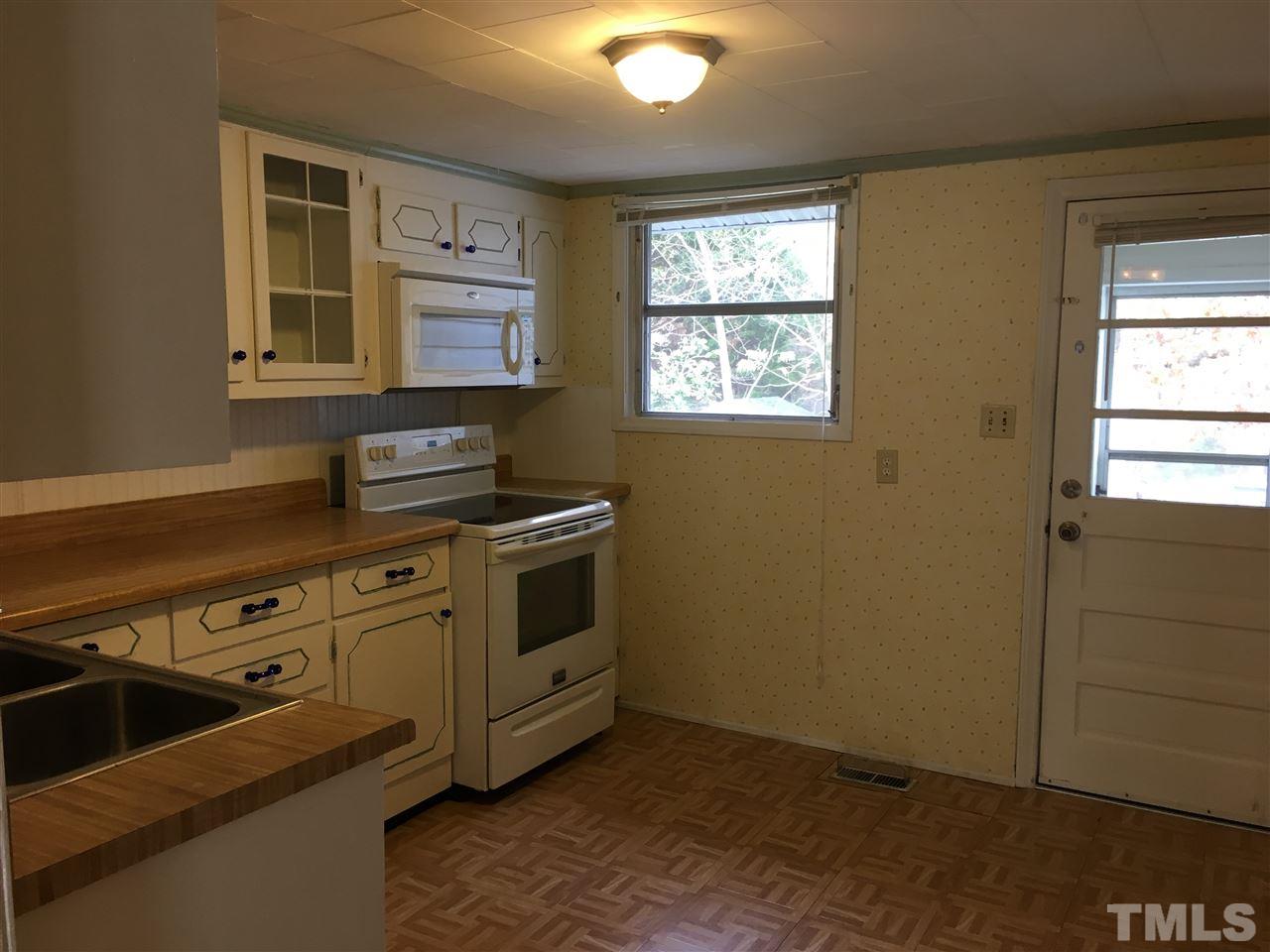31 Service Road Roxboro, NC 27574 - Photo 9 of 18 an empty room with windows