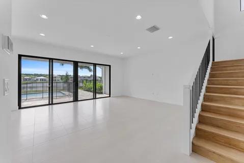 a bathroom with a double vanity sink mirror and bathtub